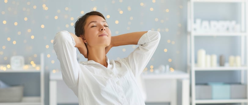 Woman appearing to take a deep breath with her chin tilted upward—a common but suboptimal posture. 