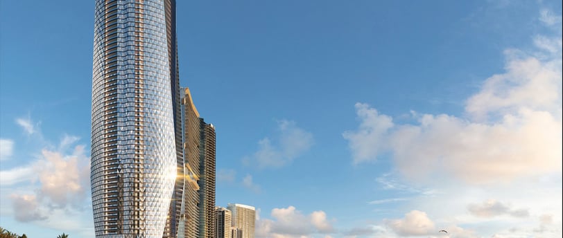 a beach with a large building in the background