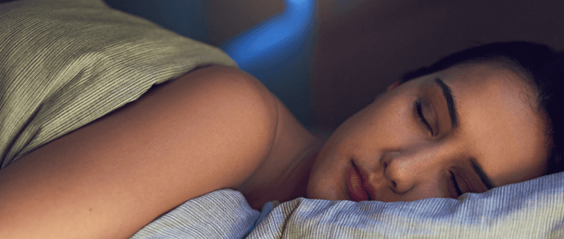 Woman sleeping soundly in bed