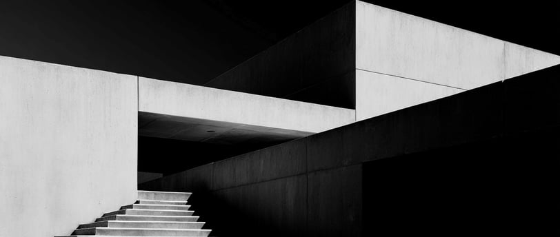 Minimalist concrete building with stairway.