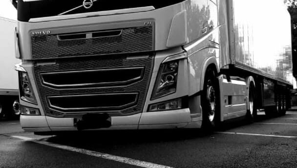 a truck with a large truck behind it