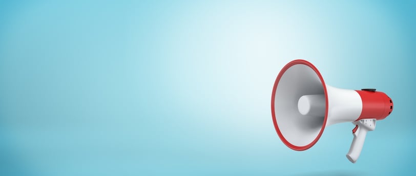 a red and white megaphone on a teal blue background