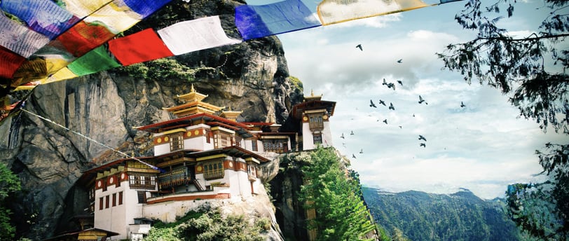 a mountaintop with a large group of flags and flags
