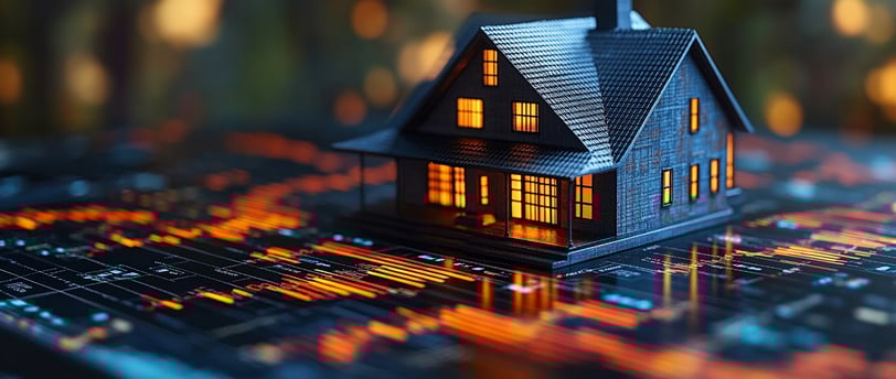 a small house sitting on top of a computer keyboard