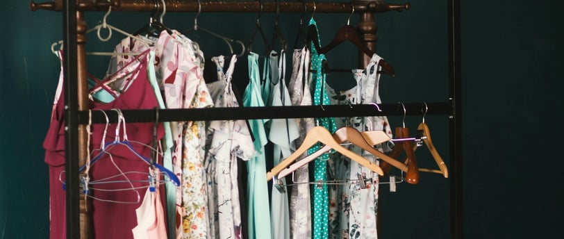 a rack of clothes hanging on a rack of clothes