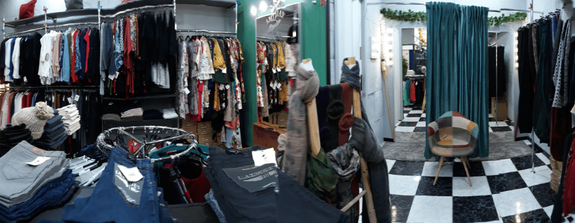 a room with clothes and clothes on display