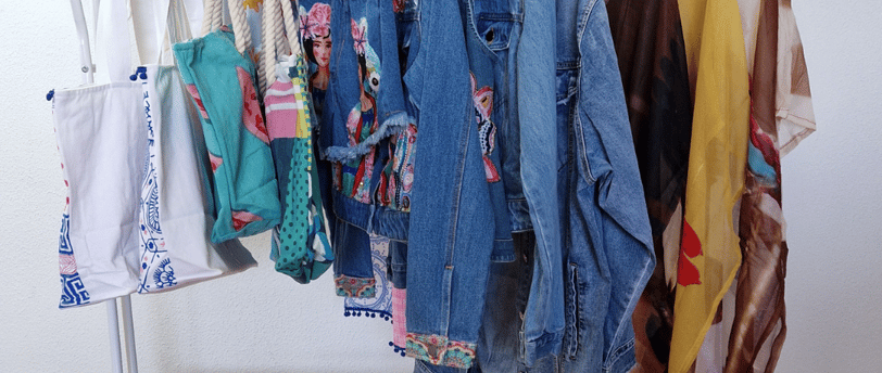 a rack of clothes hanging on a clothes rack