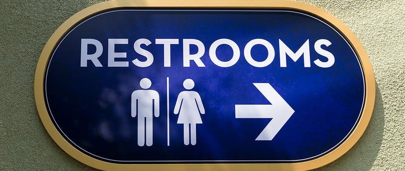 a blue sign with a man and woman restroom sign