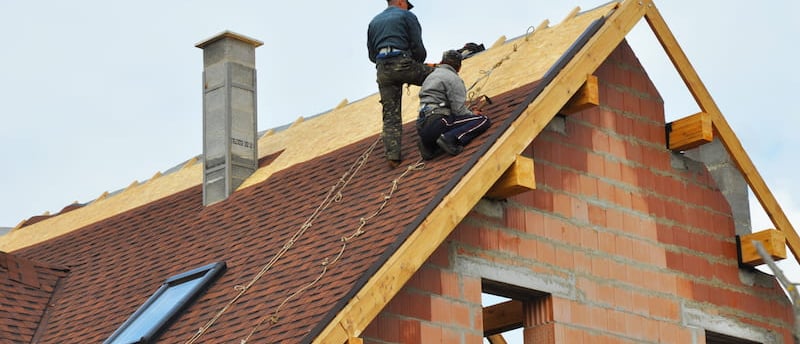 a man standing on a roof top with a roof top