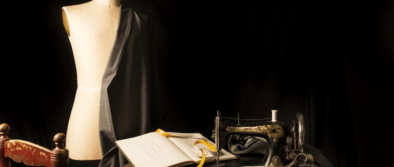 a sewing machine sitting on a table with a book and a sewing machine