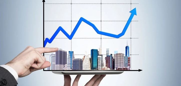a person holding a tablet with a graphing graphing on it