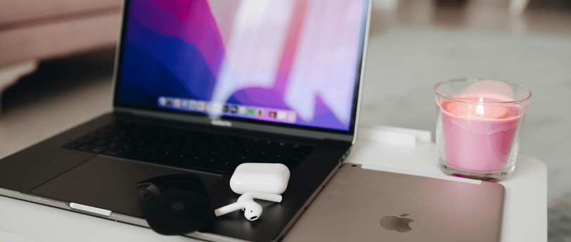 a set of apple airpods 4 on a laptop computer sitting on a table
