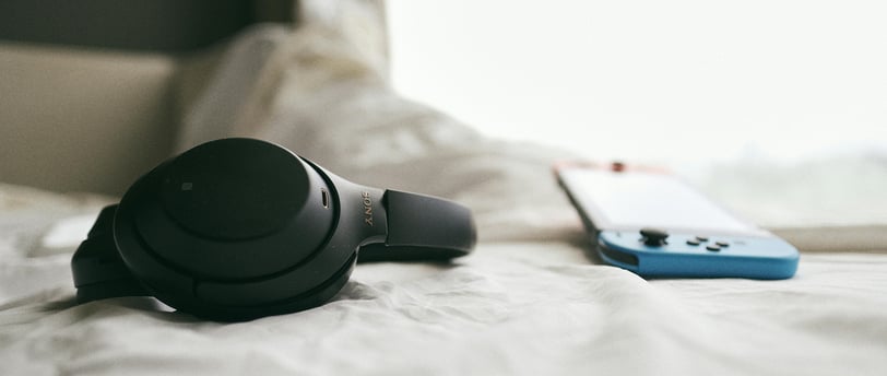 sony WH-1000XM4 headphones resting on a surface