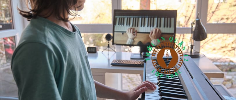 a young boy playing a piano in a room