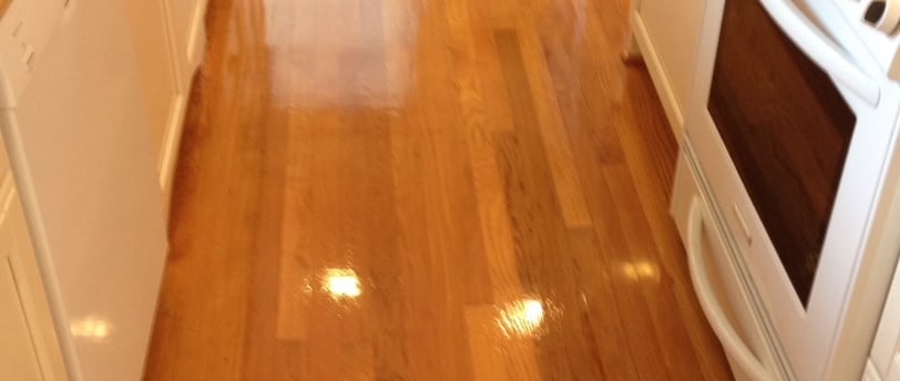 "Cleaning hardwood floors in Daytona Beach, FL in a small office kitchen by TEC Floor Services."