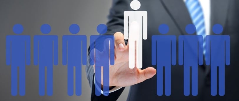 a man in a suit and tie is holding a paper cutout of a person