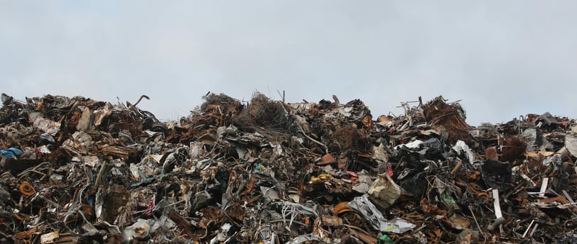 a pile of metal pipes and other metal objects