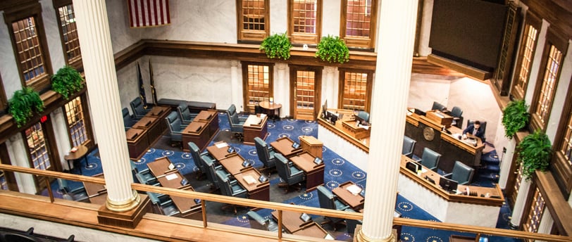 a large meeting room with a lot of chairs and tables