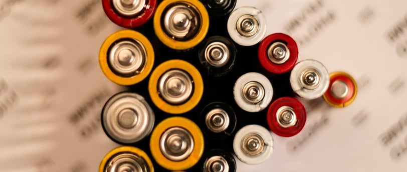 a pile of batteries on a table