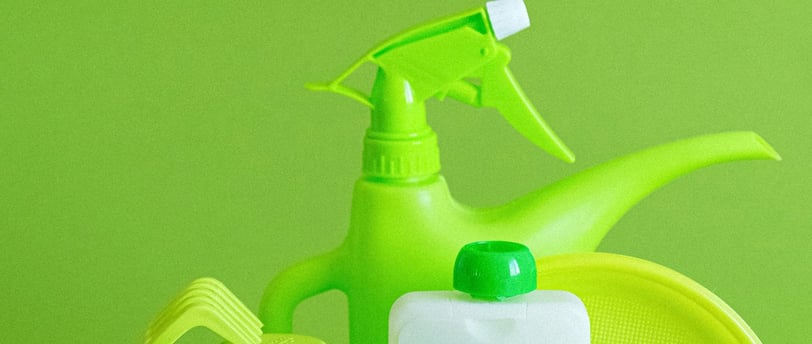 a variety of cleaning products including a bottle of cleaner
