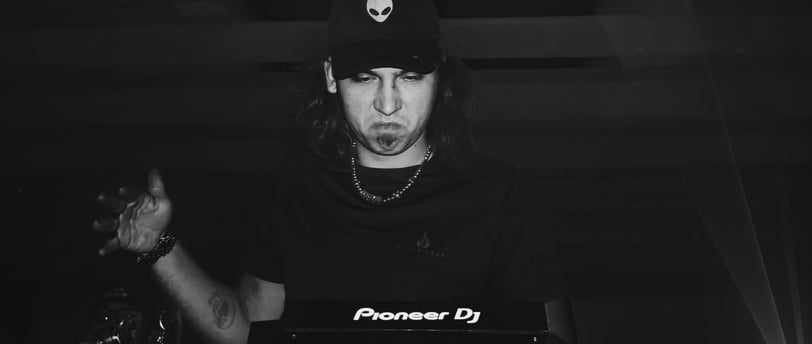 a man in a black shirt and a hat