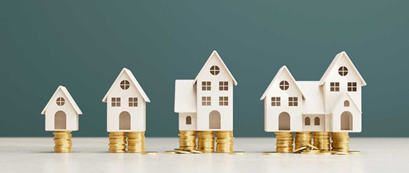 Imagem de avaliação de casas para venda representada por diferentes tamanhos de imóveis e valores.