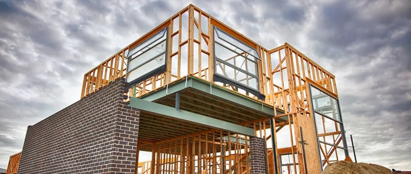 a house being built with a large wooden frame