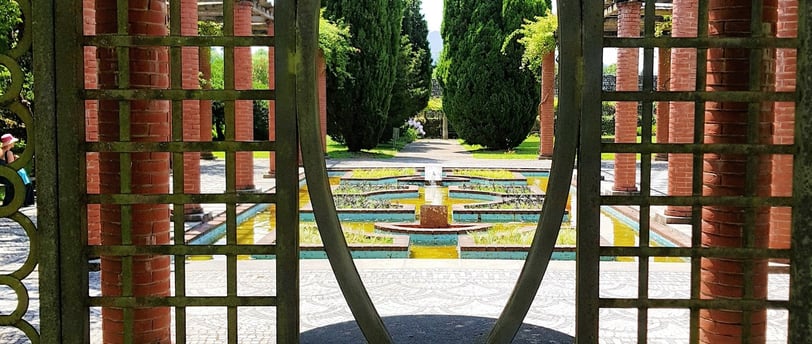 a circular shaped metal gate with a circular mirror