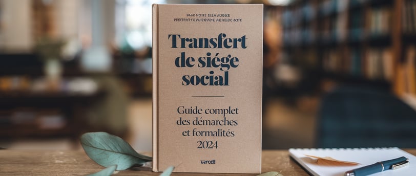 a book with a pen and a notebook on a table LEGALIS