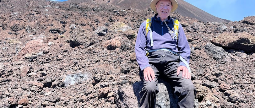 Having a rest on a hike up Mount Etna, Europe's highest volcano in May 2022. in May 2022.
