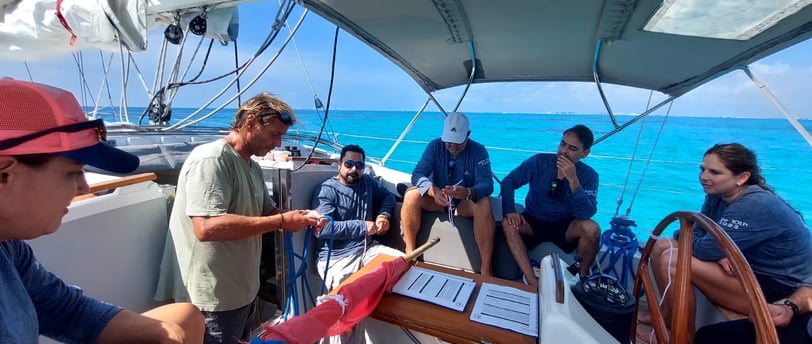 a group of people on a sailing course in Cancun 