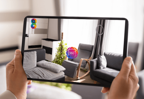 a person holding a tablet with a picture of a living room
