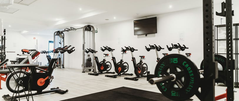 a gym room with a bunch of exercise equipment