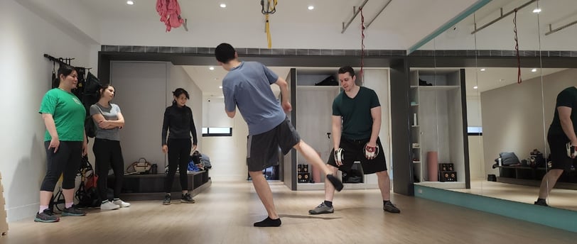Practicing striking on the focus mitts.