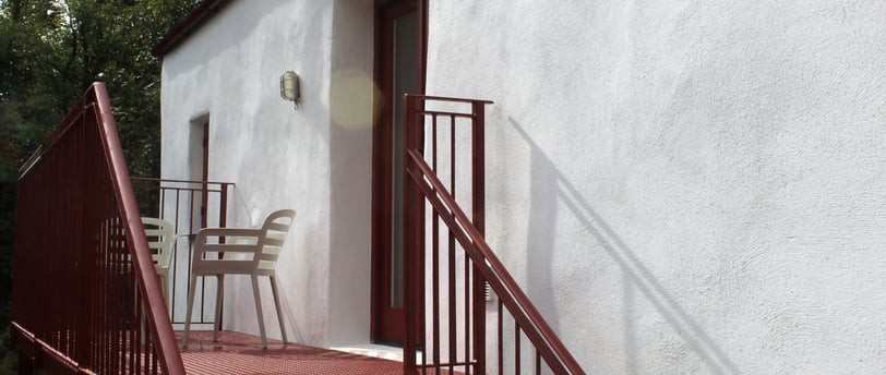 A private balcony with seating