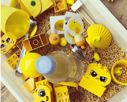 a container filled with legos and legos