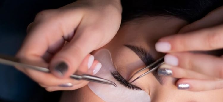 a woman is doing a makeup job on her eyebrows