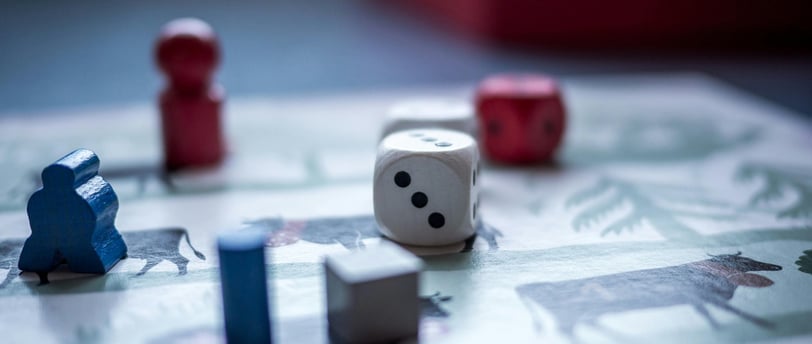 Board game with game pieces and dice