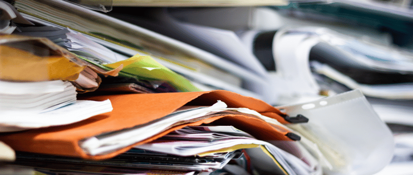 a pile of papers and papers on a desk
