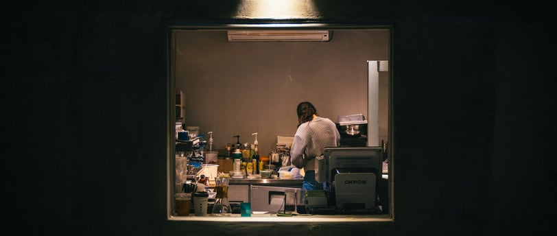 woman working in the kitchen late at night