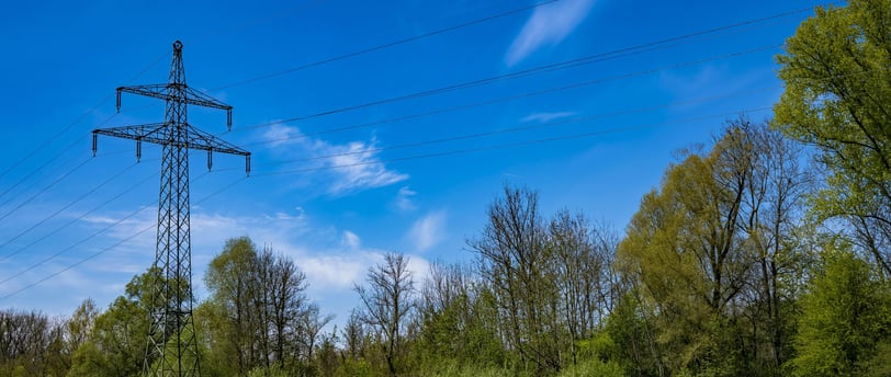 power lines in grassy field
