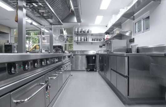 a kitchen with stainless steel appliances and stainless steel appliances