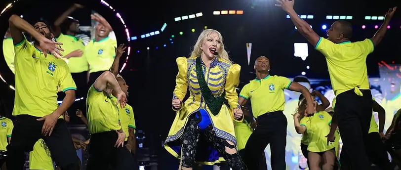 a woman in a yellow dress and a man in a yellow shirt and black pants