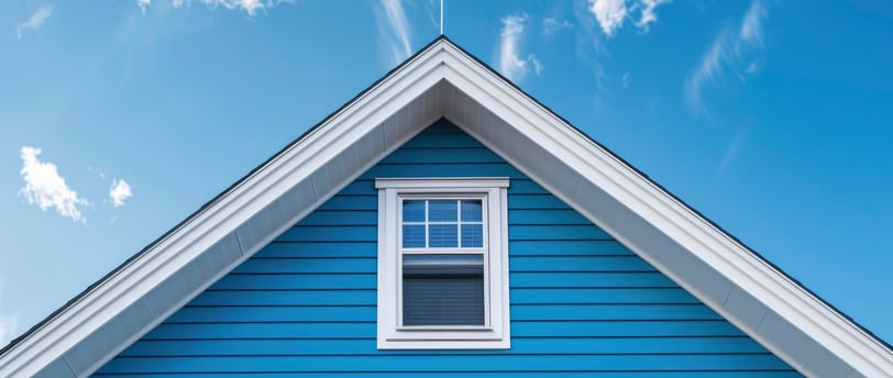 House with blue vinyl siding