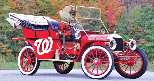 an old car with the Washington Nationals logo and Teddy Roosevelt driving