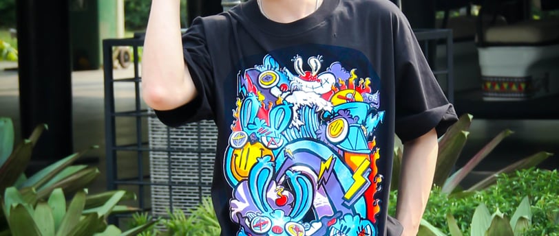 a man in a black shirt and sunglasses