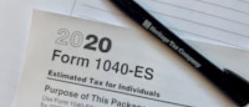 Tax return document on desk, key for small business due diligence and financial review.