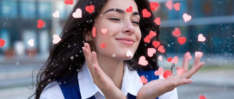 Beautiful woman surrounded by floating hearts