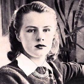 Paula Jean Welden in a sweater dress and a necklace
