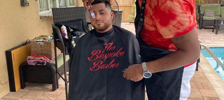 "An image showcasing the concept of mobile barbering, where a professional barber provides haircare